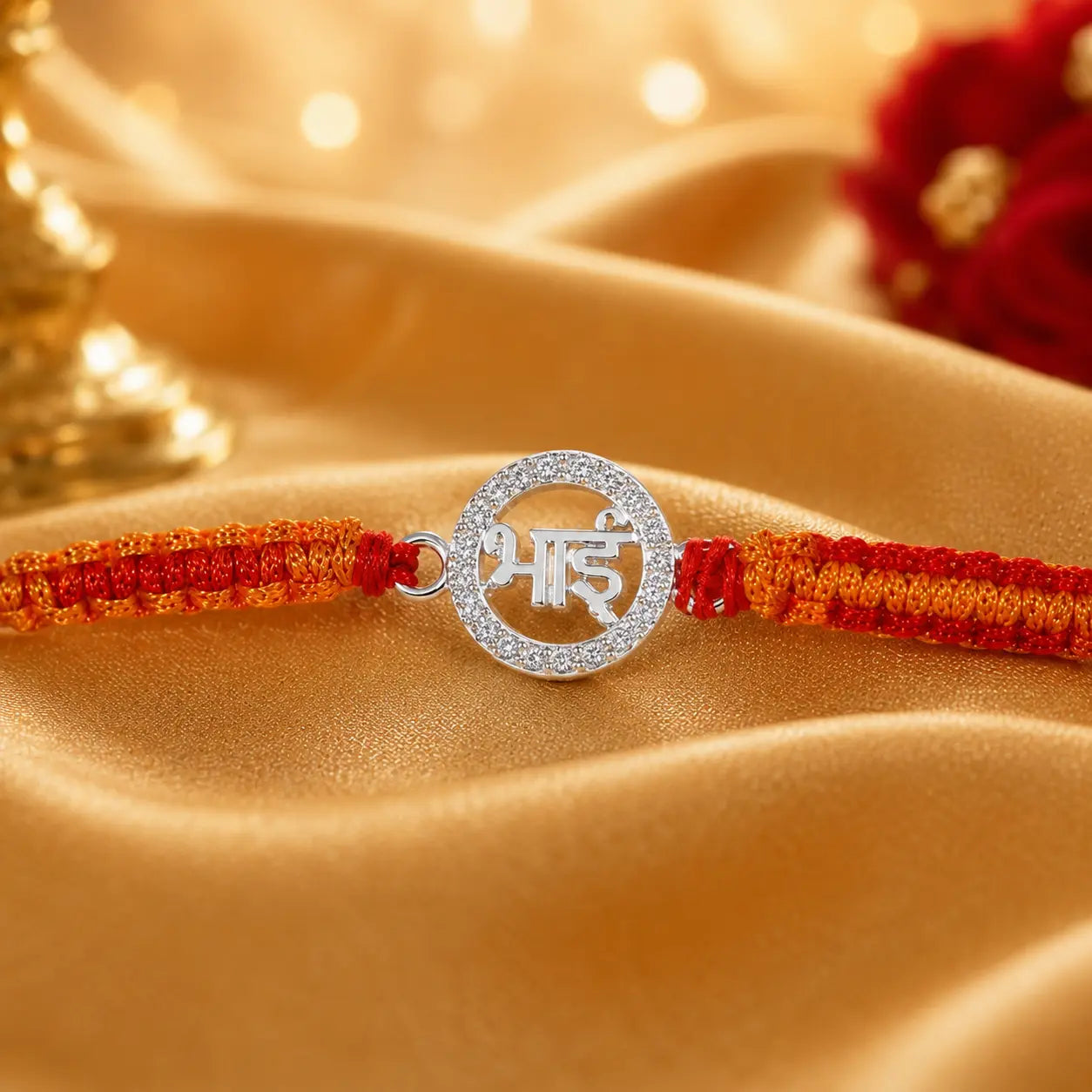 925 Sterling Silver Bhai Rakhi with Orange and Red Handmade Thread on Beige Velvet Cushion for Raksha Bandhan