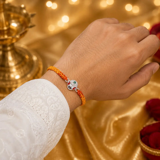 925 Sterling Silver Khatu Naresh Rakhi featuring Khatu Shyam Ji with saffron orange braided thread for Raksha Bandhan, premium silver Rakhi for brother