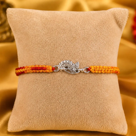 925 Sterling Silver Krishna Flute Rakhi with Peacock Feather Design and Handmade Orange Red Sacred Thread for Raksha Bandhan