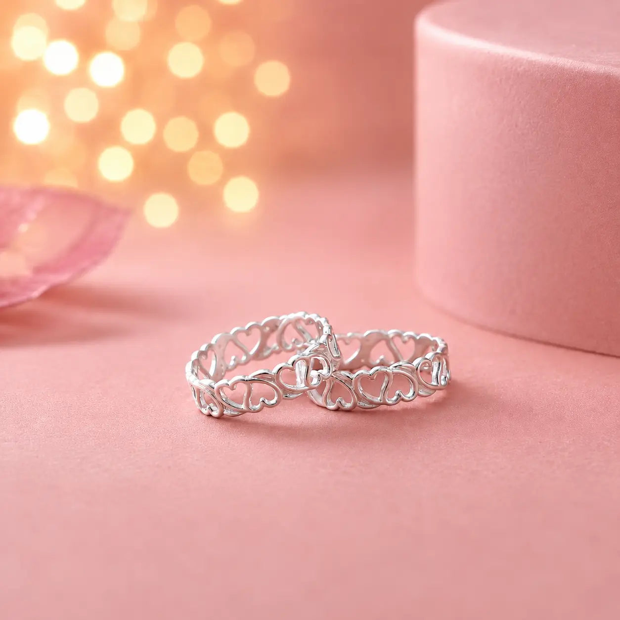 925 sterling silver adjustable heart design toe rings pair on soft pink background with luxury jewelry photography