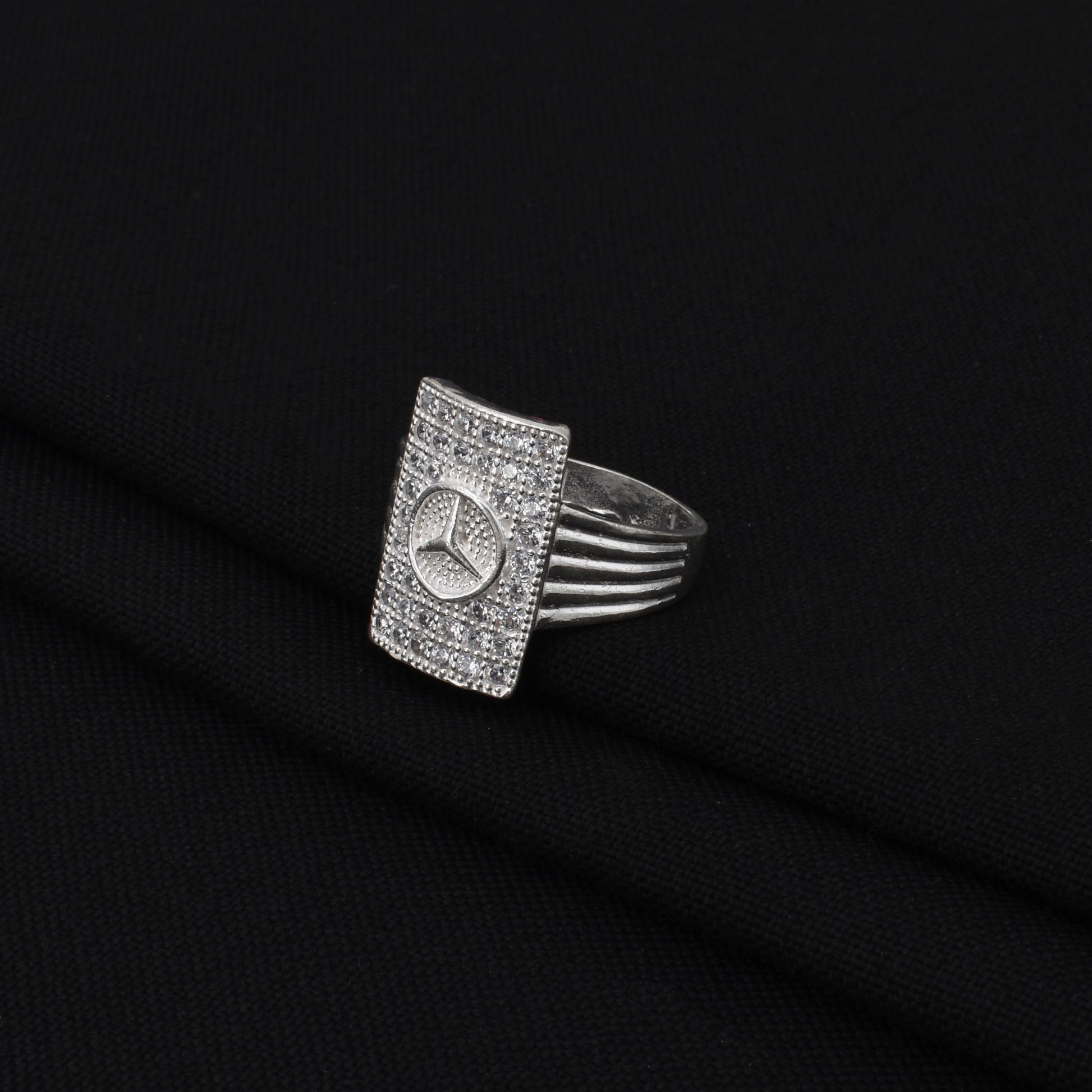 Stylish silver boys' ring showcasing the iconic Mercedes symbol, designed for a sophisticated and fashionable look.