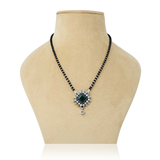 Sterling silver mangalsutra with a center square green stone and delicate flower design