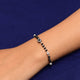 Stylish bracelet for girls featuring a silver and black evil eye charm, accented with black and silver beads