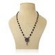 Elegant silver mangalsutra for girls featuring a flower design with green and purple gemstones