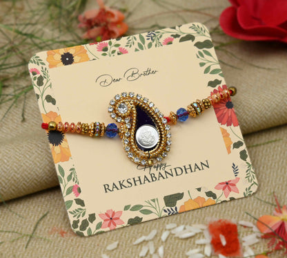 Silver center Ganesh Ji design with a black theme and colorful beads, perfect Rakhi for boys