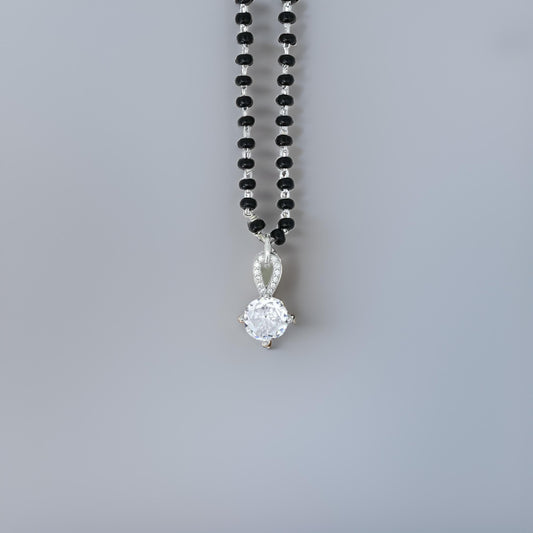 Elegant sterling silver pendant with a round cut CZ stone in a mystical magic design for her