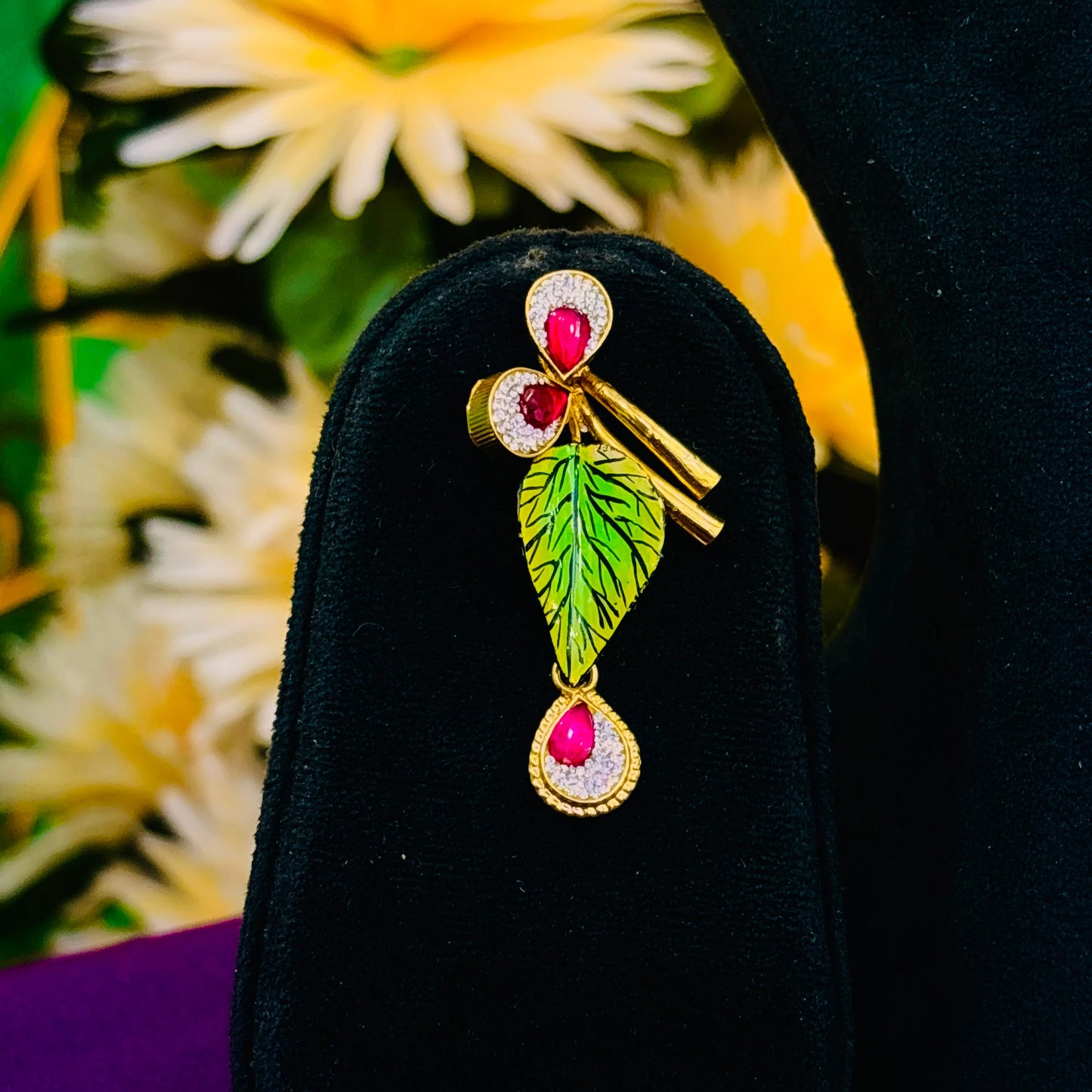 Charming Gold Polish Silver Necklace with Large Flower Center, Gold Leaves, and Pink Gemstones.