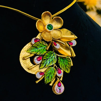 Charming Gold Polish Silver Necklace with Large Flower Center, Gold Leaves, and Pink Gemstones.