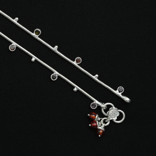 Charming silver anklet adorned with a lite Celtic pattern and colorful beads, perfect for a unique and playful style