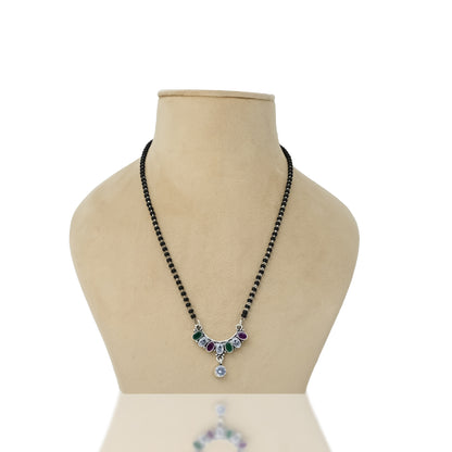 Sterling silver mangalsutra featuring a bow shape with purple and green gemstones