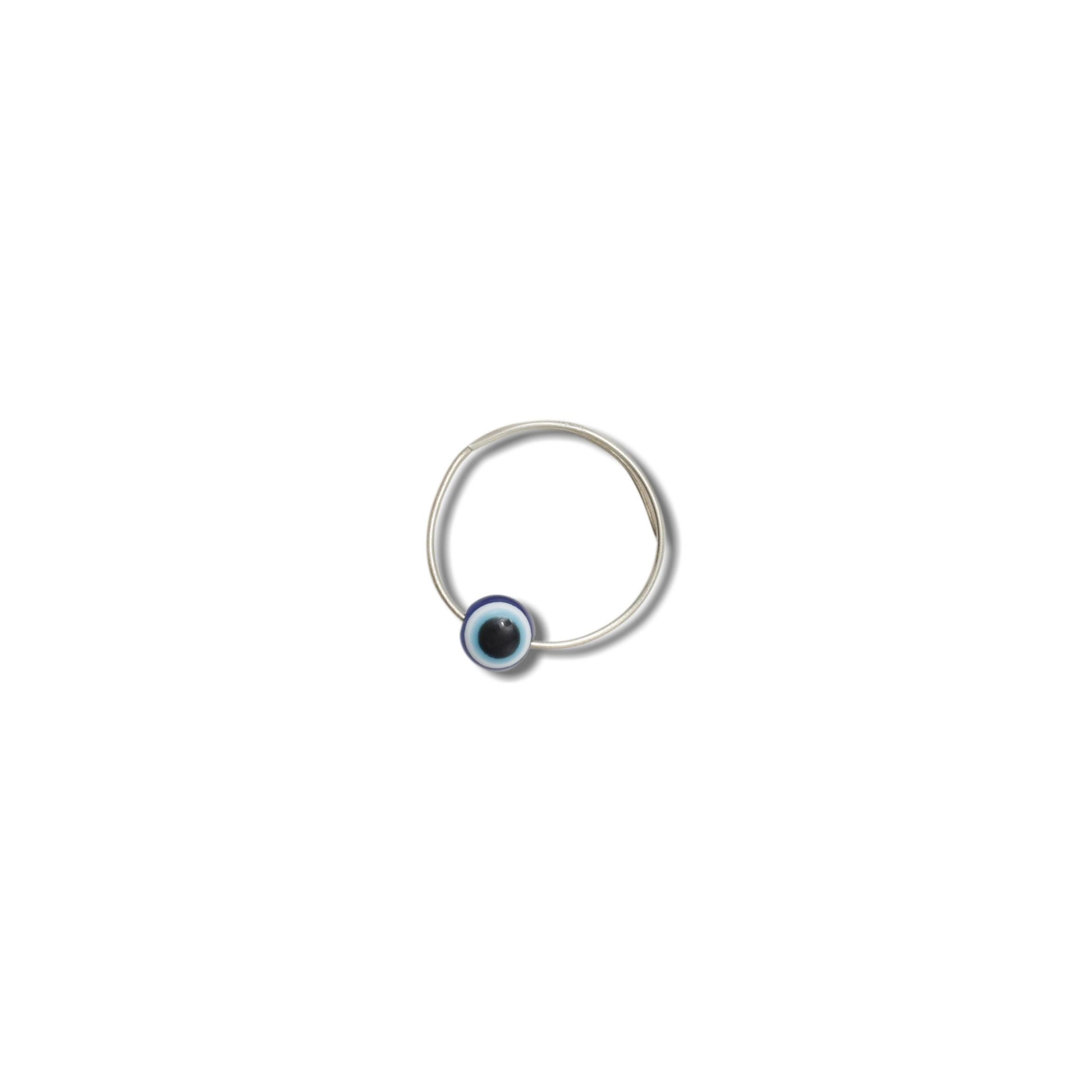 Silver girls' ring featuring a protective evil eye symbol, offering a stylish and meaningful accessory.