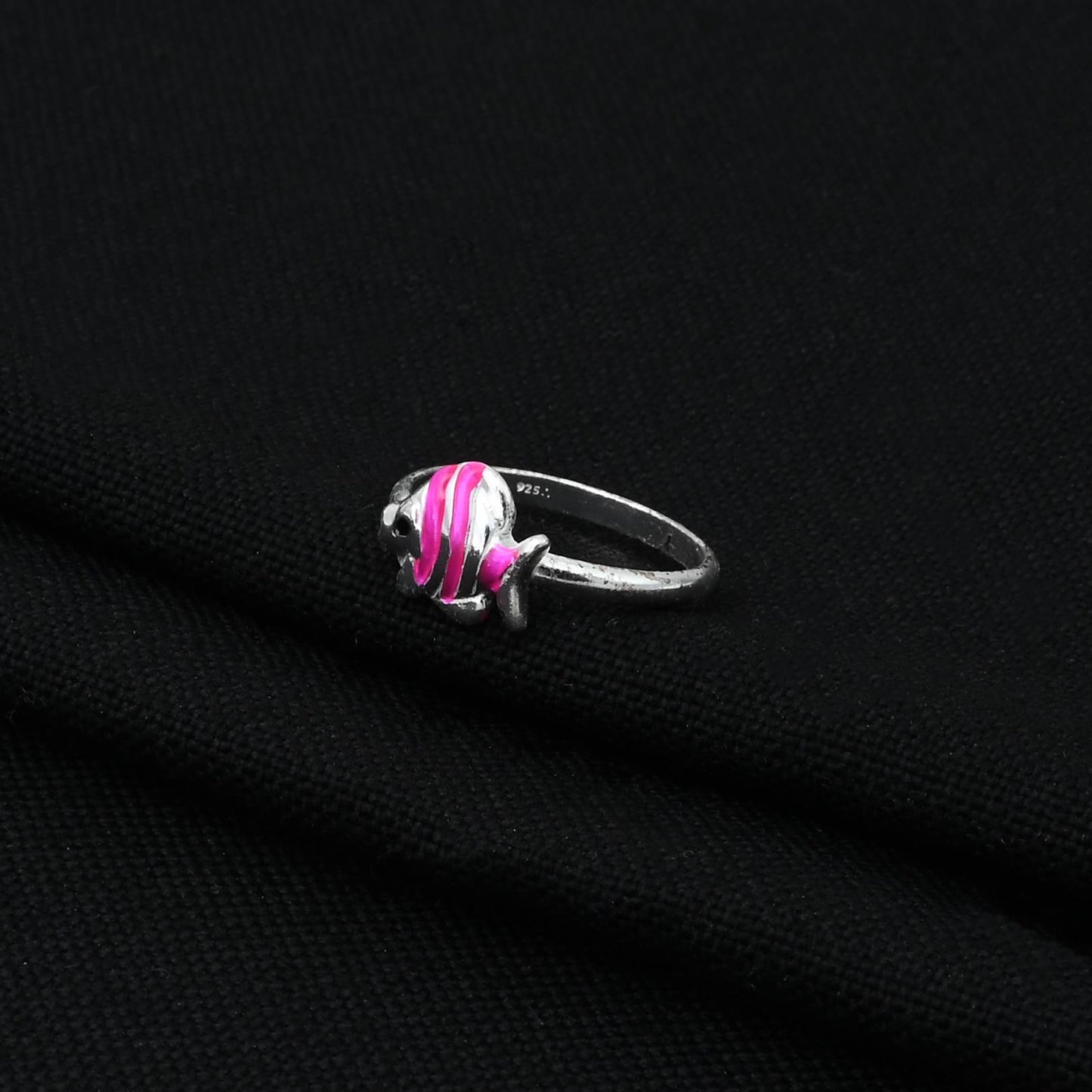 Stylish silver baby ring adorned with a charming pink fish design.