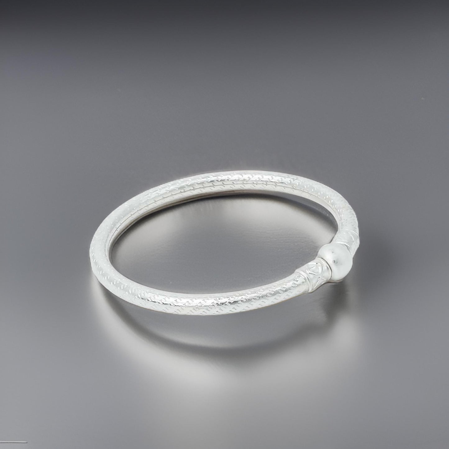 Charming silver baby kada with a clean, minimalist design