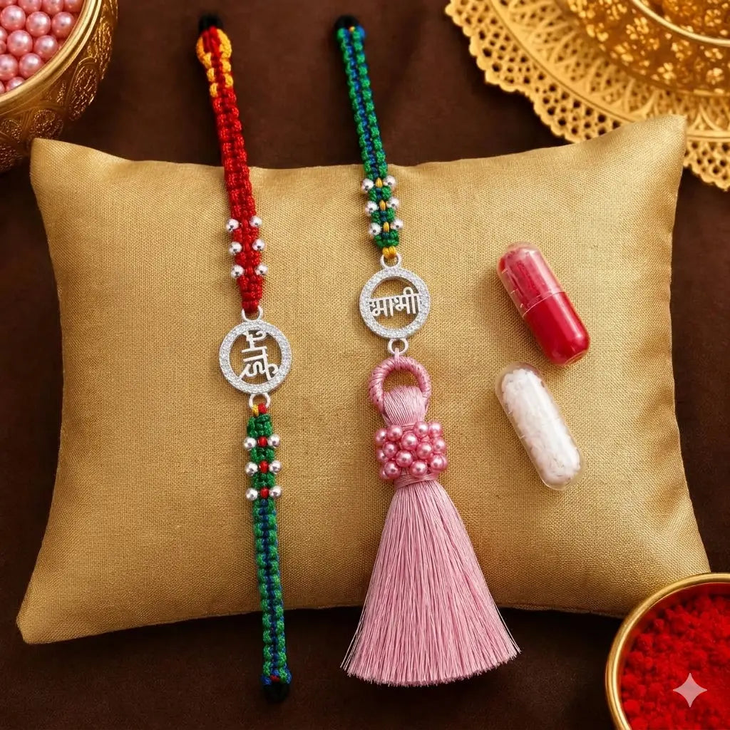 Bhai Bhabhi Rakhi set with silver stone circular charm, red green thread and pink tassel Lumba Rakhi on beige velvet cushion festive background
