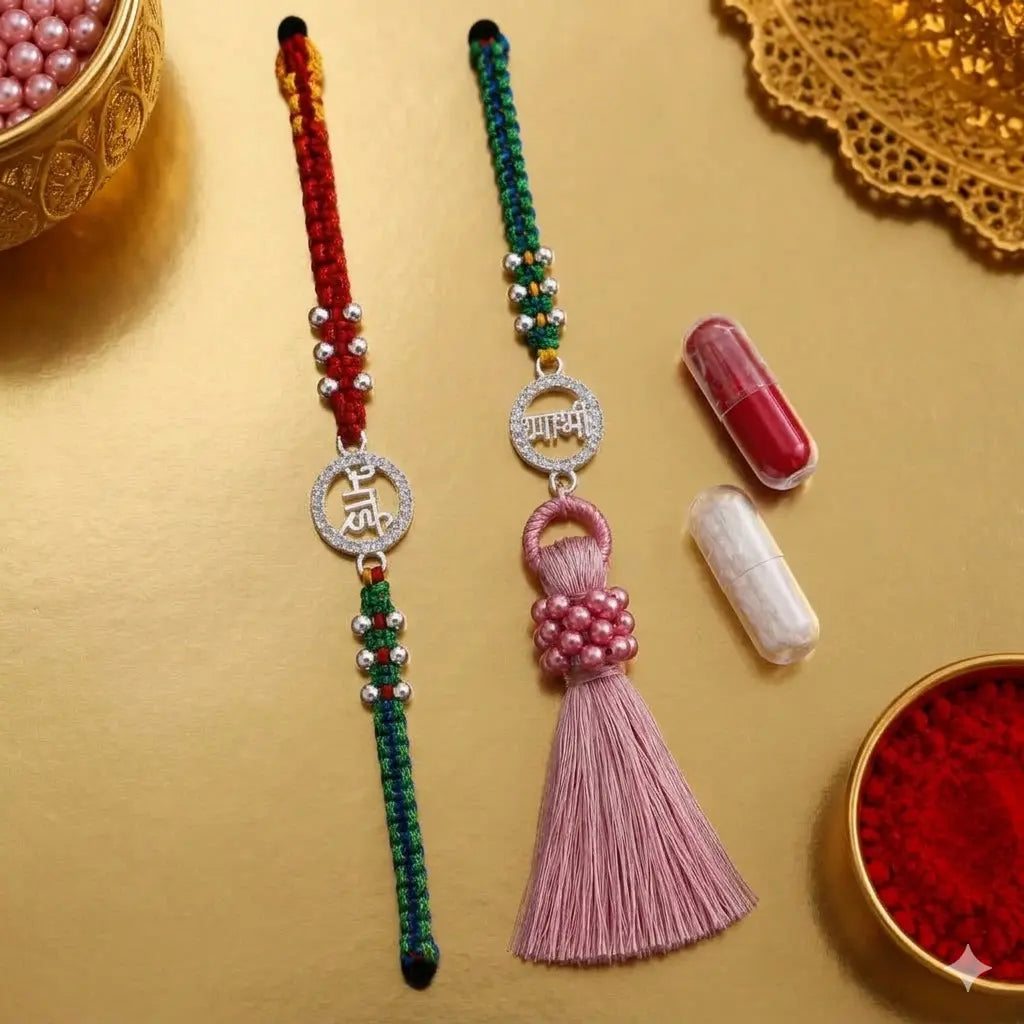Bhai Bhabhi Rakhi set with silver stone circular charm, red green thread and pink tassel Lumba Rakhi on beige velvet cushion festive background