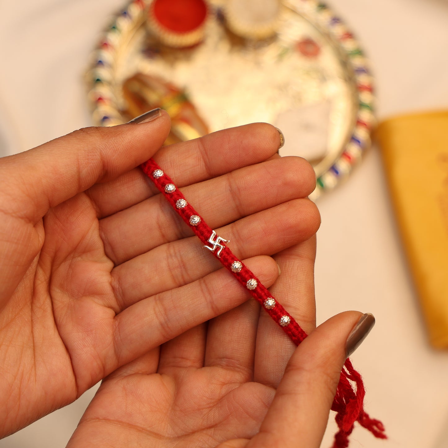 Divine Swastika Silver Rakhi Thread