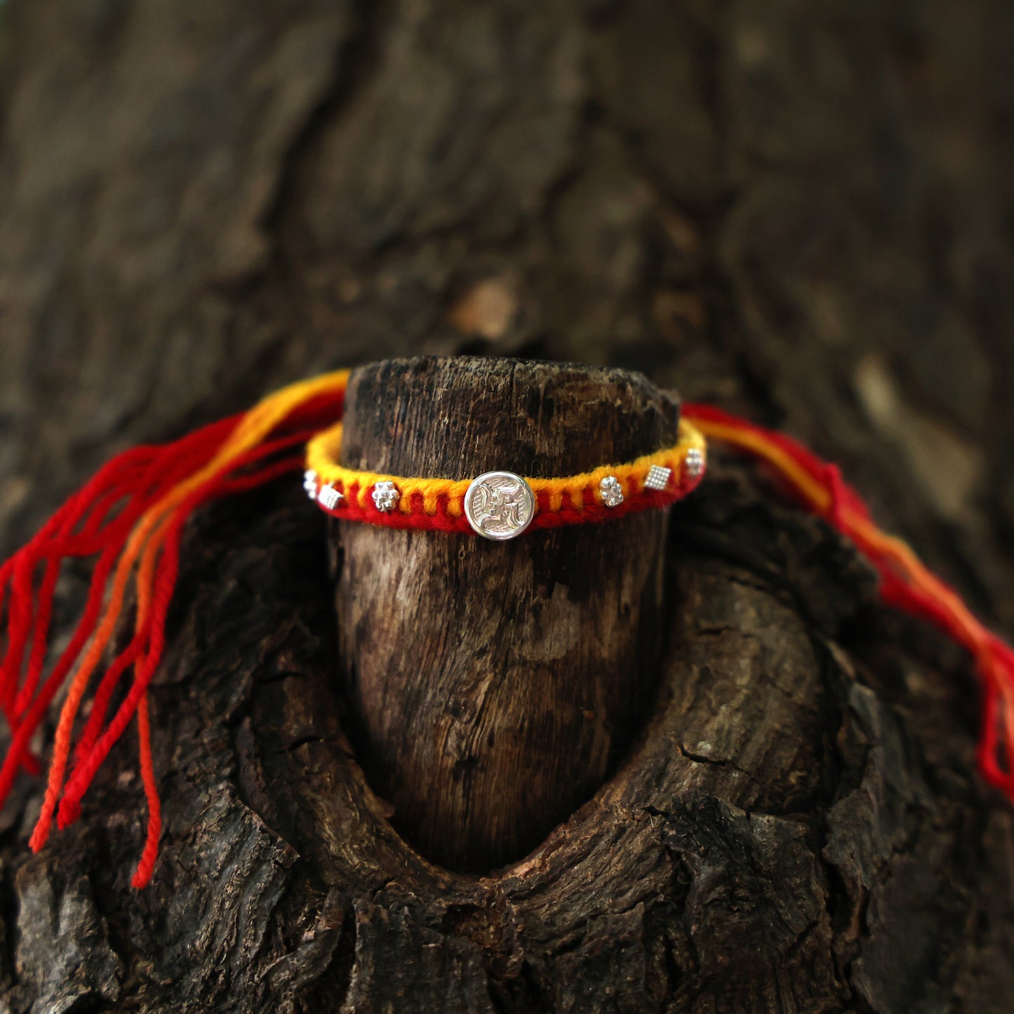 Swastik Charm Rakhi in Silver