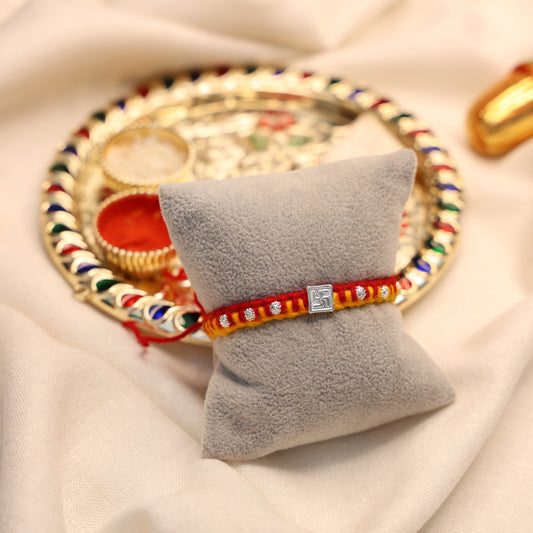 Swastik Glow Silver Rakhi Edition