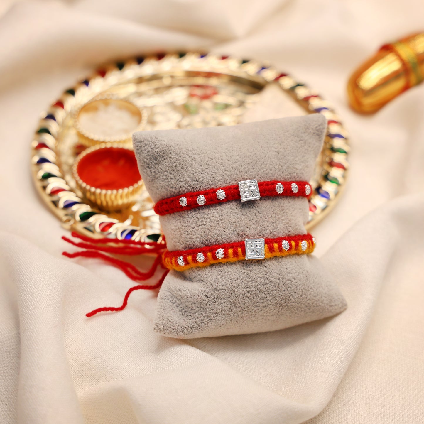 Swastik Glow Silver Rakhi Edition