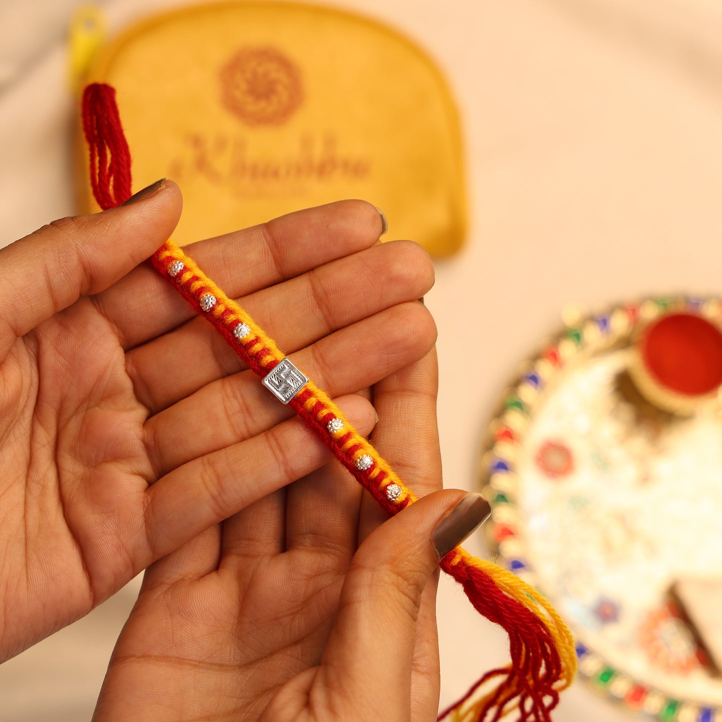 Swastik Glow Silver Rakhi Edition