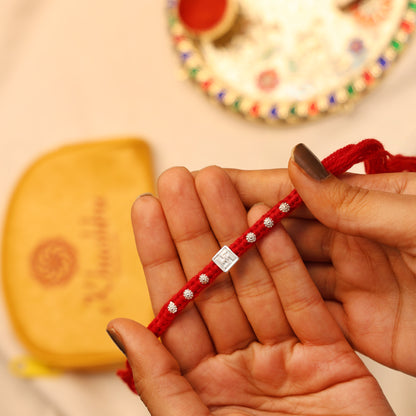 Swastik Glow Silver Rakhi Edition