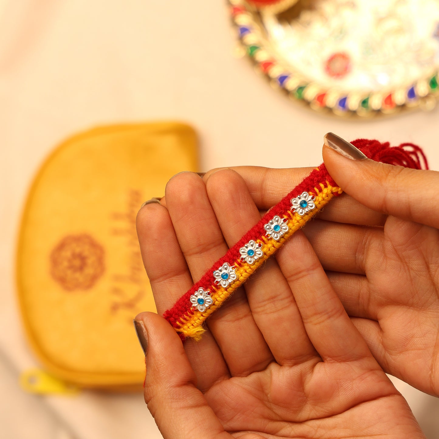 Delicate Silver Floral Rakhi