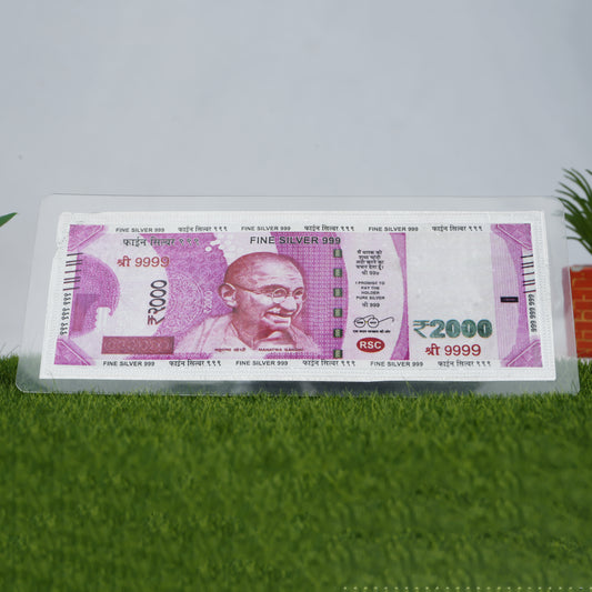Elegant 999 silver 2000 Rupee note, reflecting light with fine craftsmanship from Khushbu Jewellers
