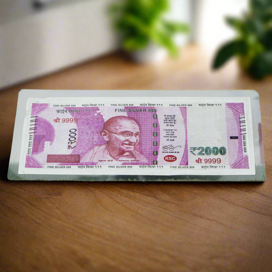 High-quality image of the 999 silver 2000 Rupee note by Khushbu Jewellers, featuring exquisite details