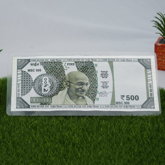 Elegant 999 pure silver 500 Rupees currency note displayed with intricate patterns.