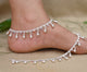 Silver anklet featuring large beads and stunning gem accents for a bold look