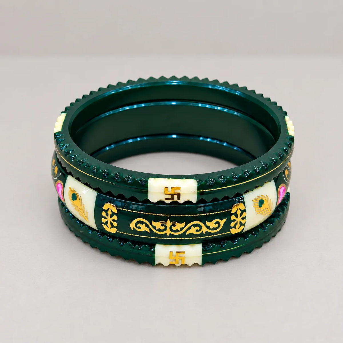 Dark Green Traditional Designer Bangles with Golden Swastika & Peacock Motifs