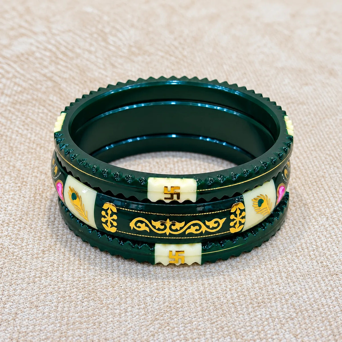 Dark Green Traditional Designer Bangles with Golden Swastika & Peacock Motifs