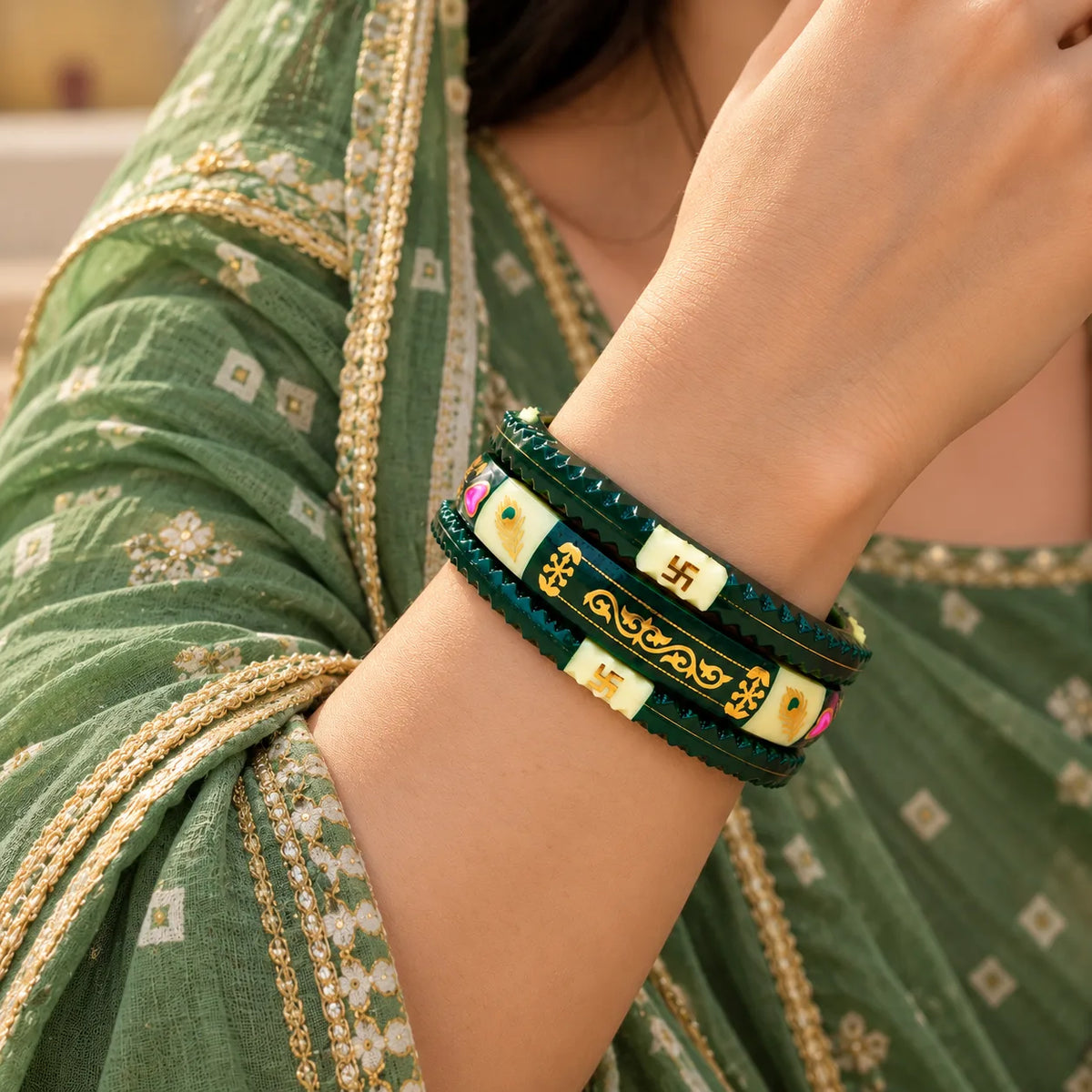 Dark Green Traditional Designer Bangles with Golden Swastika & Peacock Motifs