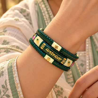 Dark Green Traditional Designer Bangles with Golden Swastika & Peacock Motifs