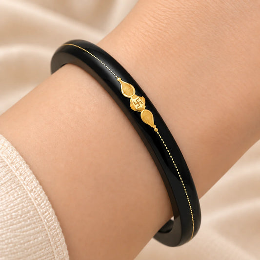 Gold Center Swathik Design Black Bangles