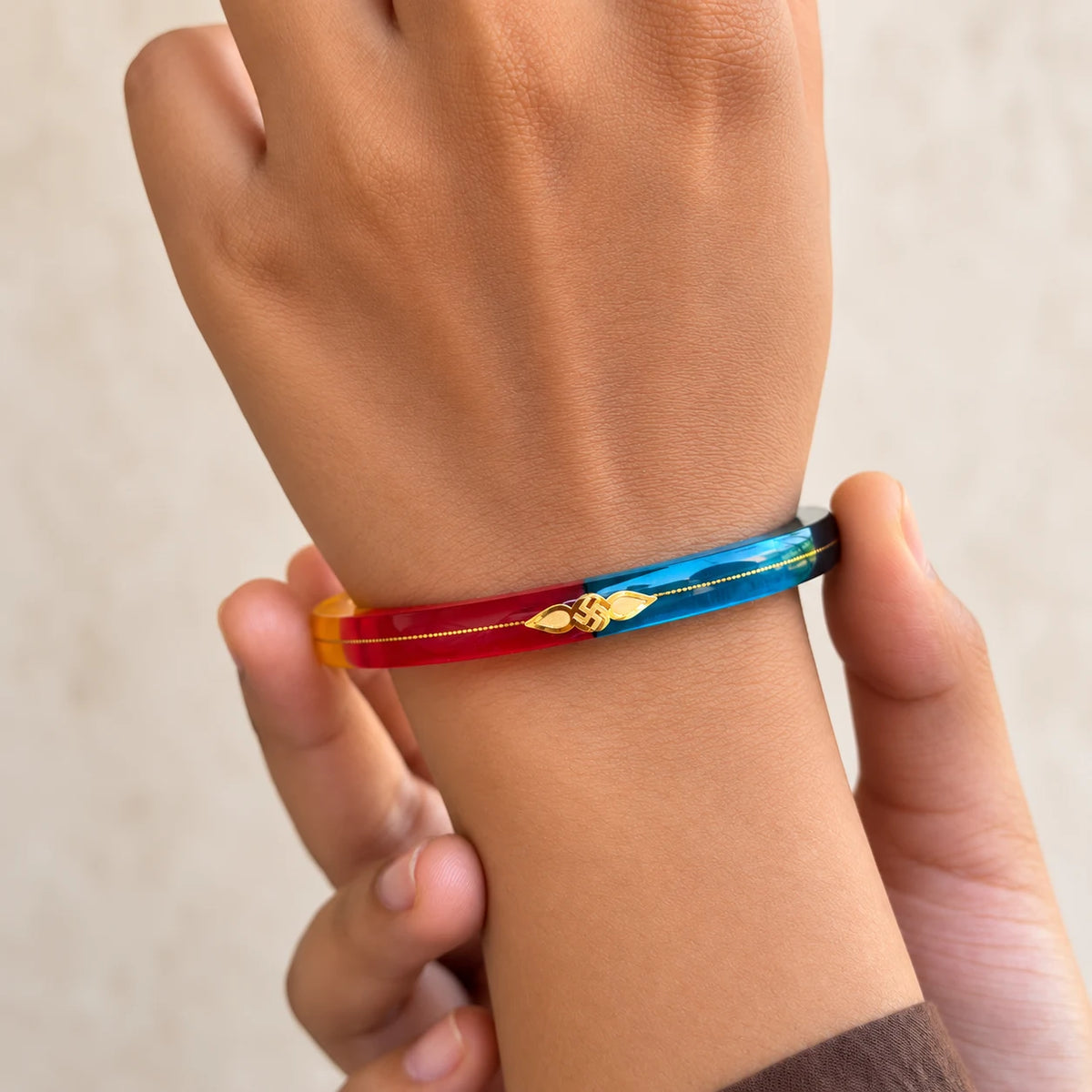 Gold Small Swastika Design Dark Color Bangle