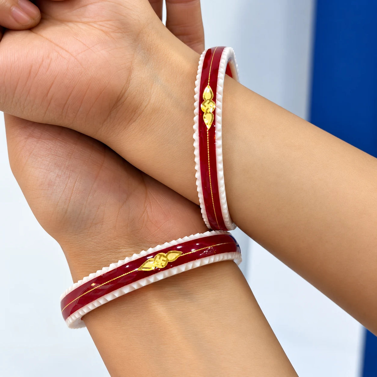 Gold Small Swastika Design light and Dark Red Bangle.
