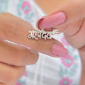 Close-up of a sterling silver Mahadev pendant with intricate detailing