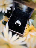Men's and boy's silver ring featuring a single white stone.