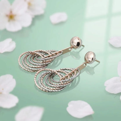 Layered Teardrop Silver Dangle Earrings with a Unique Textured Pattern