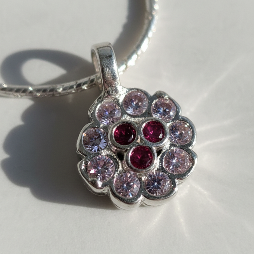 Minimal Silver Floral Pendant with Ruby Touch