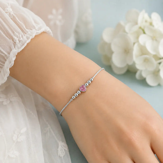 Sterling Silver Pink Heart Adjustable Bracelet for Women with Polished Silver Beads on Blue Jewelry Display