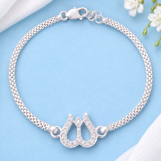 Silver Trishul Bracelet with stone-studded Shiva design on a pastel blue background