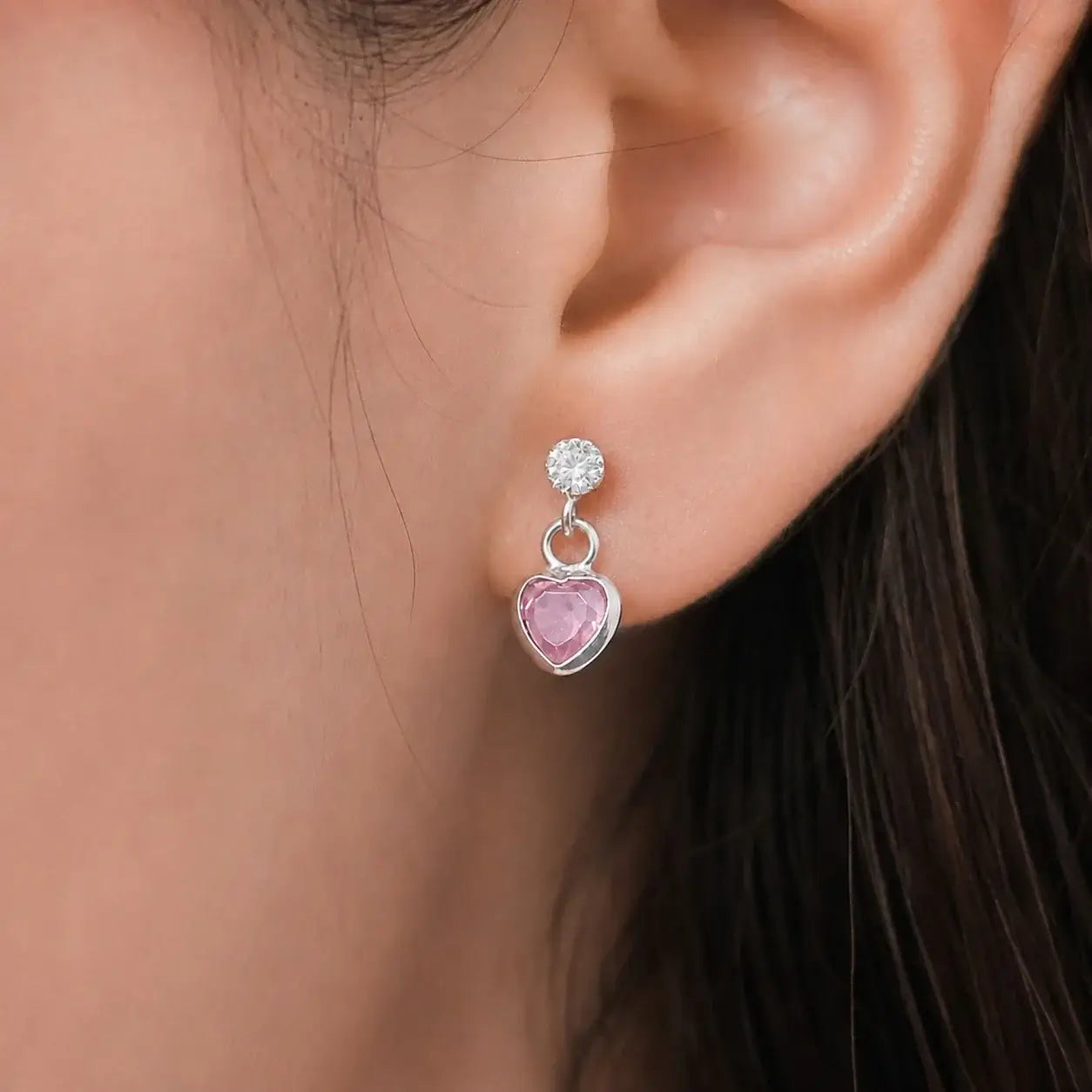 Silver black heart drop stud earrings with sparkling Cubic Zirconia stones and polished silver-tone finish for women displayed on a jewelry card.