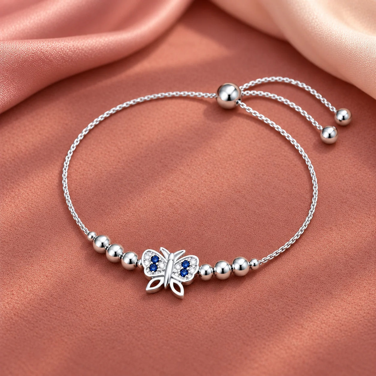Silver butterfly bracelet with blue stones