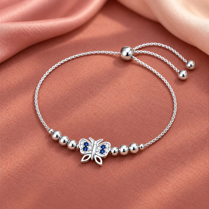 Silver butterfly bracelet with blue stones
