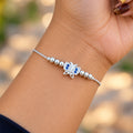 Silver butterfly bracelet with blue stones