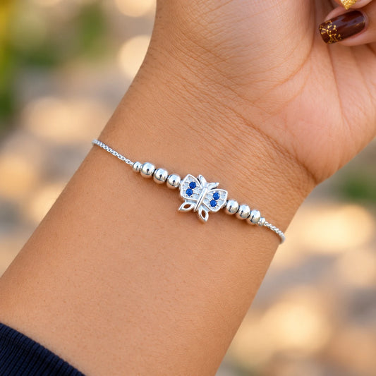 Silver butterfly bracelet with blue stones