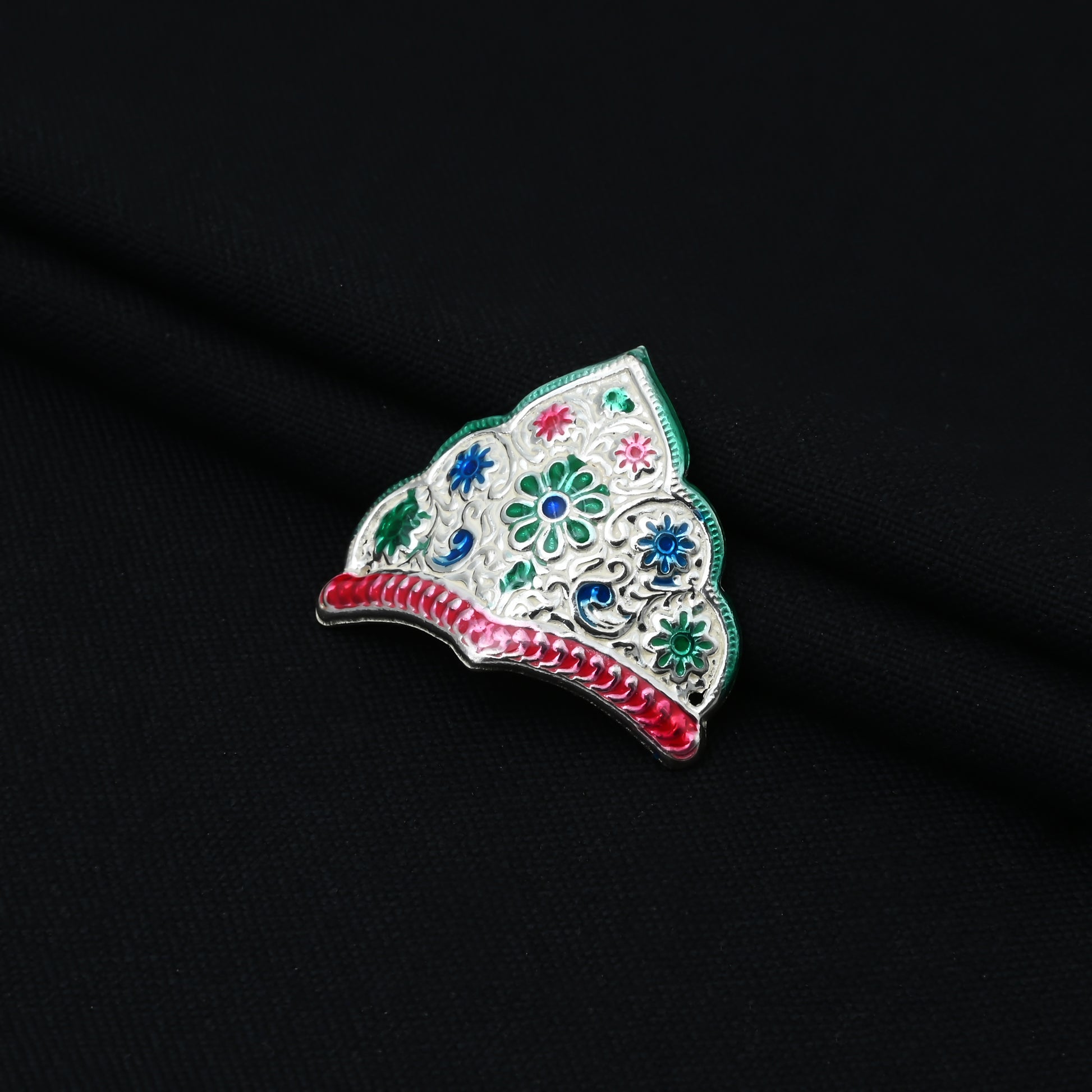 This Silver Traditional Floral Design Mini Mukut is expertly crafted with intricate floral designs, showcasing the rich cultural heritage of India. 