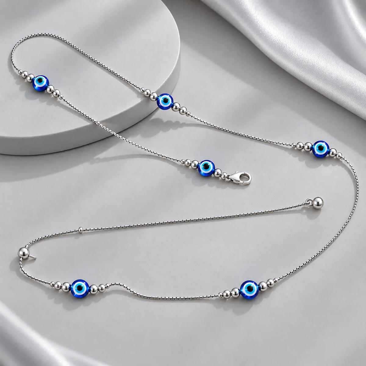 Silver evil eye waist chain for women with blue beads